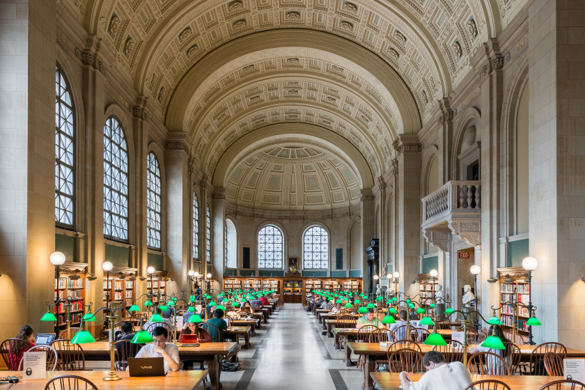 Student study space with books and warm library light